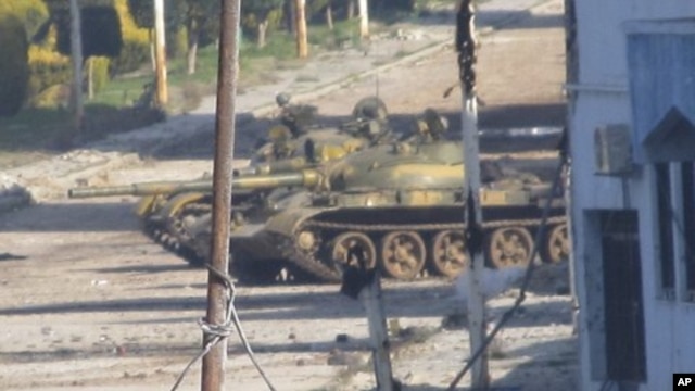 A Syrian tank is seen in Baba Amr near the city of Homs, February 12, 2012.