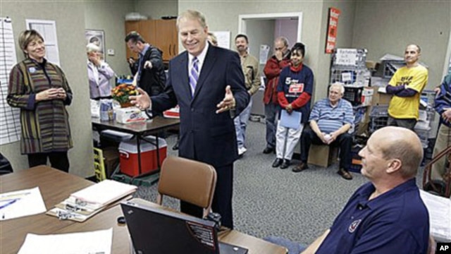 Ohio Gov. Ted Strickland, center, talks with union supporters of his re-election campaign at the Building Laborers' Hall in Cleveland, 19 Oct 2010