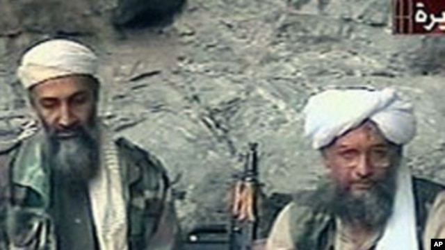 Osama bin Laden, left, and his top lieutenant, Egyptian Ayman al-Zawahri, right, are seen at an undisclosed location in this TV image broadcast, October 2001 (file photo)