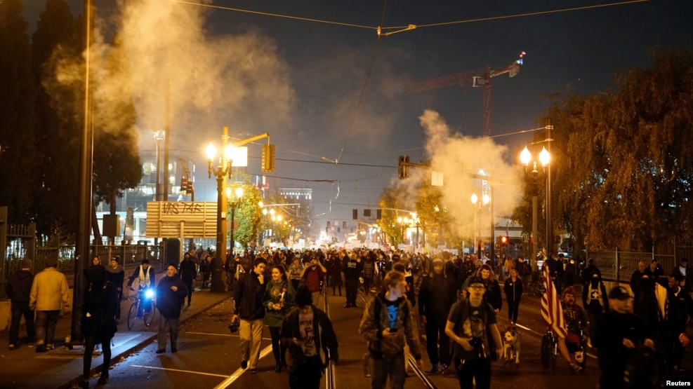 Smoke rises during a protest against the election of Republican Donald Trump as president of the United States in Portland, Oregon, Nov. 10, 2016.