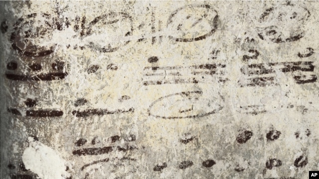 Four long numbers on the north wall of the ruined house relate to the Maya calendar and computations about the moon, sun and possibly Venus and Mars; the dates stretch some 7,000 years into the future. (Tyrone Turner © 2012 National Geographic)