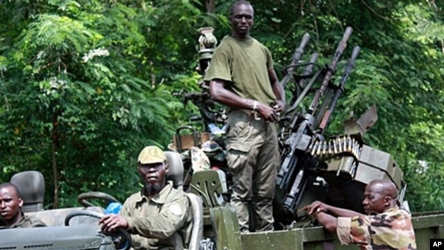 Members of Pro-Ouattara forces in Duekoue, western Ivory Coast,  March 29, 2011