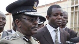 Kenyan Commissioner of Police Mathew Kirai Iteere, left, addresses media on the weekend attack on the police officers in Samburu, northwestern Kenya at Wilson Airport Nairobi, Kenya, Tuesday, Nov. 13, 2012.