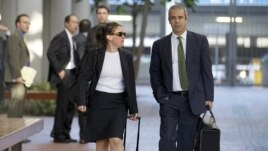 Samsung lawyers Kevin Johnson and Victoria Maroulis leave court last month after a jury in San Jose, California, ordered the company to pay Apple $1 billion for patent violations