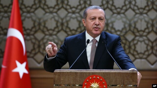 Turkish President Recep Tayyip Erdogan addresses local administrators at his palace in Ankara, Turkey, Nov. 26, 2015.  