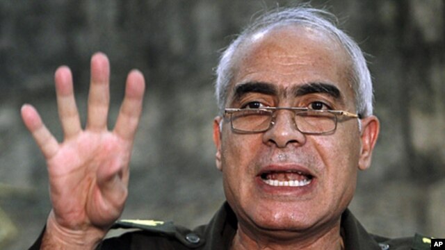 General Mahmoud Shaheen, a member of the military council, speaks during a news conference at the military media center in Cairo, March 28, 2011