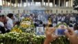 A woman mourns the death of former King Norodom Sihanouk at the Royal Palace in Phnom Penh, Cambodia,  October 16, 2012.