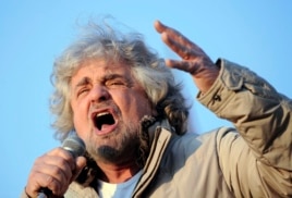 Five-Star Movement leader and comedian Beppe Grillo gestures during a rally in Turin, Italy, Feb. 16, 2013.
