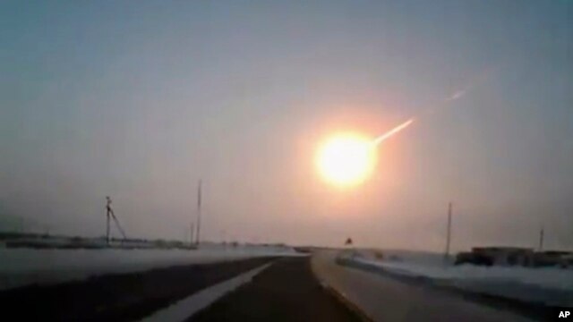 In this frame grab made from a video done with a dashboard camera, on a highway from Kostanai, Kazakhstan, to Chelyabinsk region, Russia, provided by Nasha Gazeta newspaper, February 15, 2013 a meteorite contrail is seen. A meteor streaked across the sky 