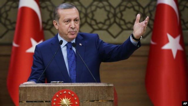 FILE - Turkish President Recep Tayyip Erdogan addresses a meeting of local administrators at the presidential palace in Ankara, March 16, 2016.