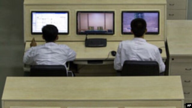 North Korean technicians man computer terminals at North Korea's space agency's General Launch Command Center on the outskirts of  Pyongyang, April 11, 2012.