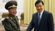 Choe Ryong-hae (kiri), utusan presiden Korut, berjabat tangan dengan Liu Yunshan (kanan) anggota Partai Komunis China dalam lawatannya di Beijing (23/5). 