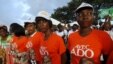 Supporters of Ivory Coast's President Alassane Ouattara and his party, the Rally of the Houphouetists for Democracy and Peace (RHDP), attend a campaign rally at the place inch alla in Abidjan, Oct. 20, 2015. 