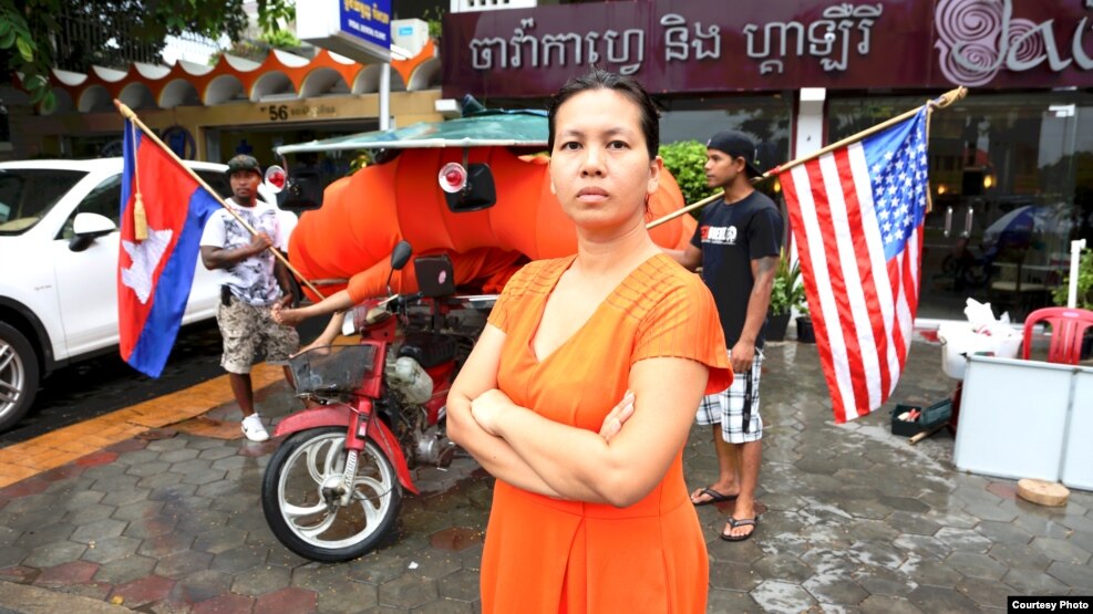 Anida Yoeu Ali with her Studio Revolt crew in production for The Buddhist Bug series. Here she stands in front of Java Cafe and Gallery in Phnom Penh, Cambodia, June 25, 2015. (Courtesy photo/Masahiro Sugano)