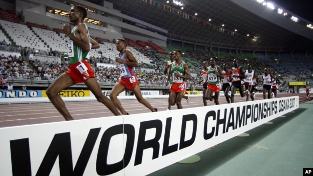 Ethiopia's Gbre-gziabher Gebrmariam, left, leads ahead of Eritrea's Zerenay Tadese, 2nd left, and Ethiopia's Kenenisa Bekele during Men's 10,000 meters race at the World Athletics Championships in Osaka, Japan, August 27, 2007.