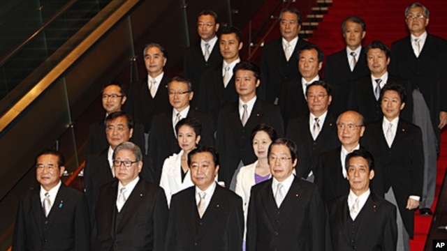 Japan's new Prime Minister Yoshihiko Noda, front row center, and some of his Cabinet members stand together during an official photo session following their first Cabinet meeting at the prime minister's official residence in Tokyo, September 2, 2011.