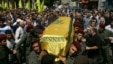 Supporters of Hezbollah and relatives of Hezbollah member Hussein Ahmad Abu Hasan carry his coffin during his funeral in Beirut's suburbs May 21, 2013.