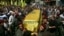 Supporters of Hezbollah and relatives of Hezbollah member Hussein Ahmad Abu Hasan carry his coffin during his funeral in Beirut's suburbs May 21, 2013.