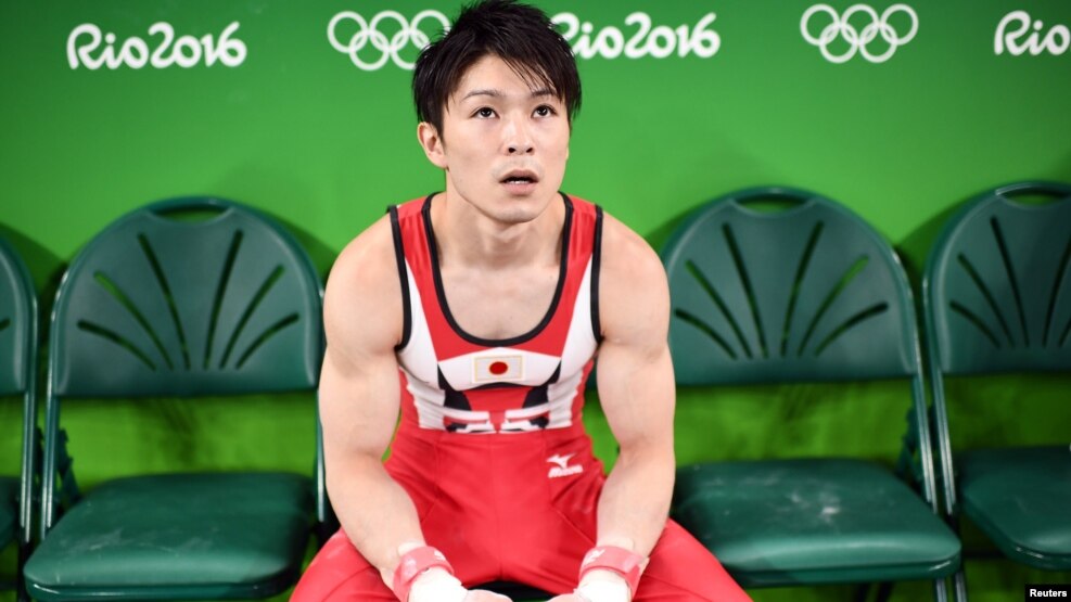 Japanese gymnast Kohei Uchimura pauses during a workout at the Rio Olympic Arena in Rio de Janeiro, Aug. 3, 2016. 