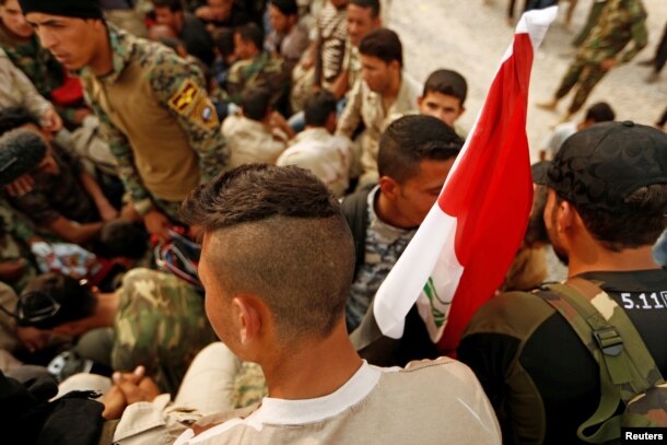 Fighters who were displaced by Islamic State gather at Debaga camp on the outskirts of Irbil, Iraq, before heading to the front line for the Mosul offensive against the group, Oct. 24, 2016.