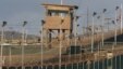 FILE - A US military member mans one of the watch towers at Camp Delta at the US Detention Center in Guantanamo Bay, Cuba. 