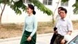 Myanmar's new de facto leader Aung San Suu Kyi, left, arrives at a hospital for her eye operation in Naypyitaw, April 9, 2016. 