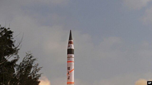 India's Agni-V missile lifts off from the launch pad at Wheeler Island off India's east coast, April 19, 2012.