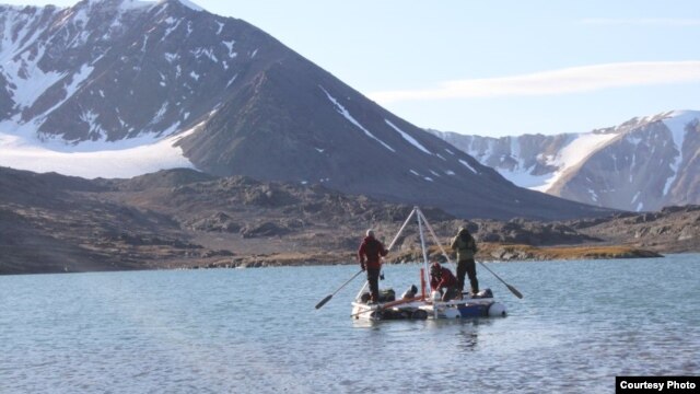 From this small platform perched atop two inflatable rafts, these scientists are able to take sediment cores from the lake floor below. (Credit: Marthe Gjerde)