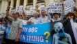 Demonstrators, holding signs to protest against Taiwanese enterprise Formosa Plastic and environmental-friendly messages, say they are demanding cleaner waters in the central regions after mass fish deaths in recent weeks, in Hanoi, Vietnam, May 1, 2016.