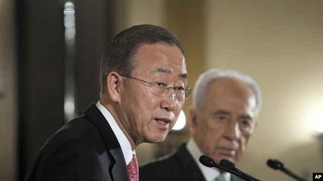 U.N. Secretary-General Ban Ki-moon addresses the media next to Israel's President Shimon Peres in Jerusalem, February 1, 2012.