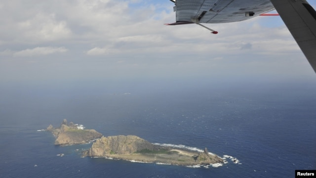 Handout photograph taken on a marine surveillance plane B-3837 shows the disputed islets, known as Senkaku in Japan and Diaoyu in China, December 13, 2012.