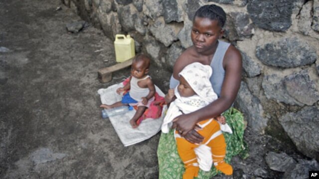 A woman looks after her two babies after being abandoned by her husband for being raped, in Goma. UNICEF estimates over 1,000 women and girls are raped per month in the Democratic Republic of Congo (File)