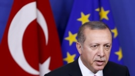 Turkey's President Tayyip Erdogan talks to the media before a meeting with European Commission President Jean-Claude Juncker (not pictured) at the EU Commission headquarters in Brussels, Belgium, Oct. 5, 2015. 