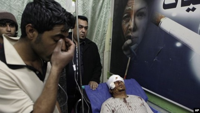 Mohammed Ali lies in a hospital bed after being injured in a car bomb attack in Zafaraniyah, Baghdad, Iraq,  Jan. 27, 2012.
