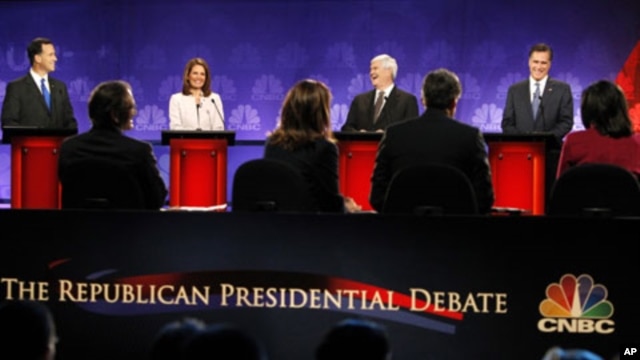 Republican presidential candidates (L-R) Rick Santorum,  Michele Bachmann, Newt Gingrich and Mitt Romney take part in the CNBC Republican presidential debate in Rochester, Michigan, November 9, 2011.