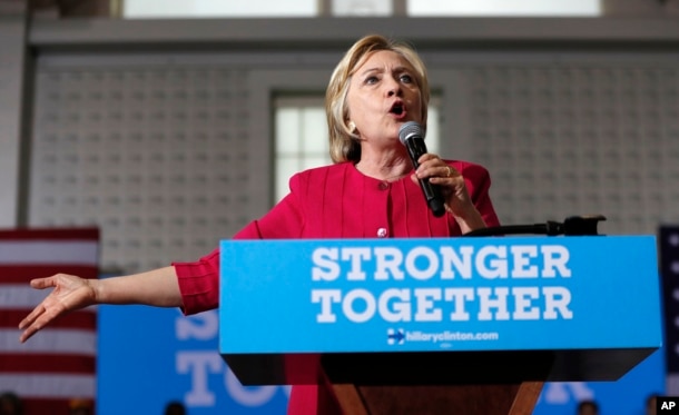 FILE - A recent Associated Press investigation said more than half the people outside the government who met with Hillary Clinton — pictured above during a presidential campaign stop in Philadelphia in August 2016 — while she was secretary of state had given money, either personally or through companies or groups, to the Clinton Foundation. She has dismissed the report and other accusations of influence buying.