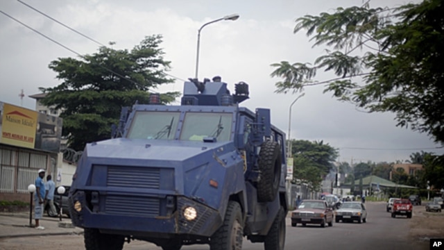 Congolese riot  police  in an armored vehicle drive the streets of  Kinshasa, Democratic Republic of Congo,  December 7,  2011.