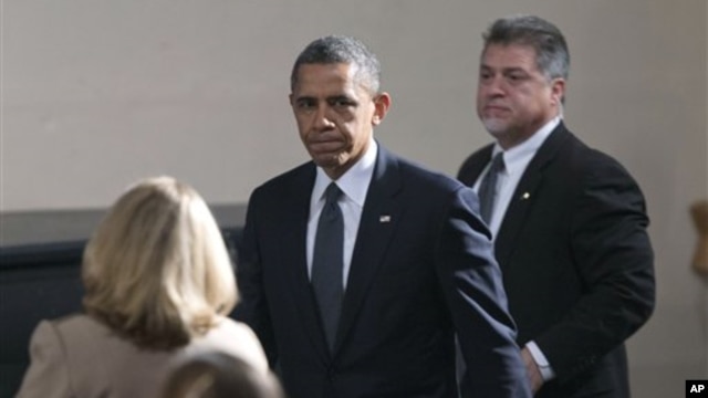 President Barack Obama arrives at the start of an interfaith vigil for the victims of the Sandy Hook Elementary School shooting on Sunday, Dec. 16, 2012 at Newtown High School in Newtown, Connecticut. 