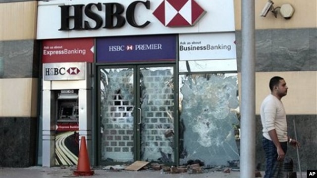 A HSBC bank branch remains damaged on the Arcadia shopping center, that was looted, damaged and set on fire by people in Cairo, Egypt, January 30, 2011.