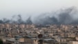 Smoke rises after airstrikes on the rebel-held al-Sakhour neighborhood of Aleppo, Syria, April 29, 2016.  