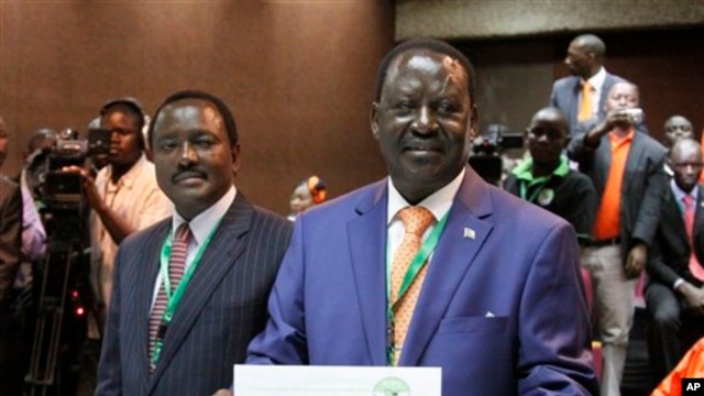 Orange Democratic Party presidential candidate, Raila Odinga (R), displays his registration certificate, with running mate Vice President Kalonzo Musyoka (L), in Nairobi, Kenya, Jan. 30. 2013.