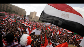 Protesters wave the Egyptian flag in Tahrir Square in Cairo, Egypt, Friday, April 8, 2011.