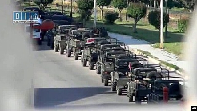 An image from footage uploaded on May 11, 2011 by Sham SNN, a Syrian opposition web channel, shows Syrian army vehicles deployed in the central industrial city of Homs