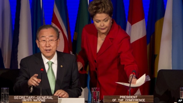 UN Secretary-General Ban Ki-Moon, left, adjusts his earphones as Brazil's President Dilma Rousseff addresses the opening session of the UN Conference on Sustainable Development, or Rio+20, in Rio de Janeiro, Brazil, June 20, 2012.