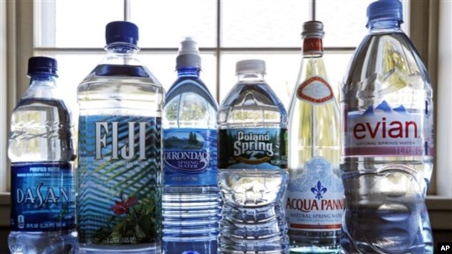 A selection of bottled waters stands on a kitchen counter in East Derry, N.H. (AP Photo/Charles Krupa)