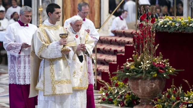 Pope Benedict XVI prepares to offer the communion as he celebrates a mass in St. Peter's Basilica at the Vatican, January 1, 2013.