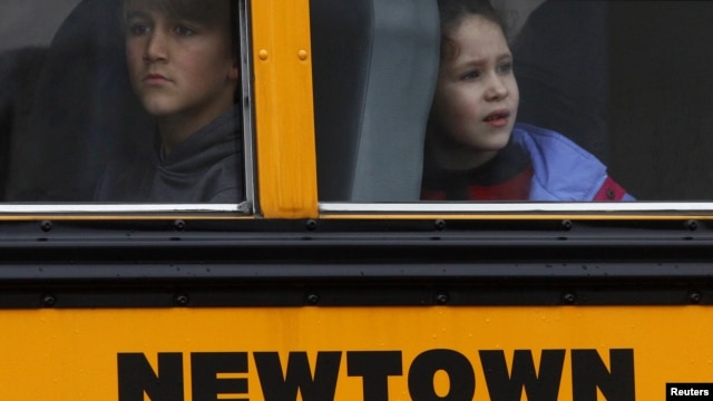 Students ride a school bus in Newtown, Connecticut December 18, 2012.
