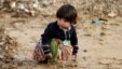A Syrian refugee girl sits on mud at a refugee camp, in the eastern Lebanese Town of Al-Faour near the border with Syria, Lebanon, Tuesday, Dec. 2, 2014. 