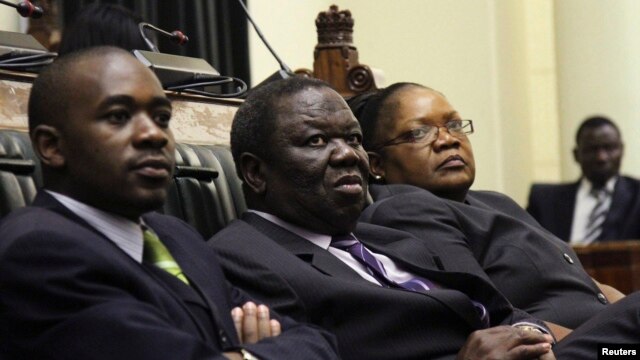 Zimbabwe VP Joice Mujuru (R), Prime Minister Morgan Tsvangirai (C) and member of the House of Assembly of Zimbabwe for Kuwadzana Nelson Chamisa attends the presentation of the Final Draft of the Constitution in Harare, February 6, 2013. 