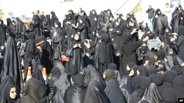 Demonstrators gather near the Pearl Monument on a main square in Manama, Bahrain, February 15, 2011